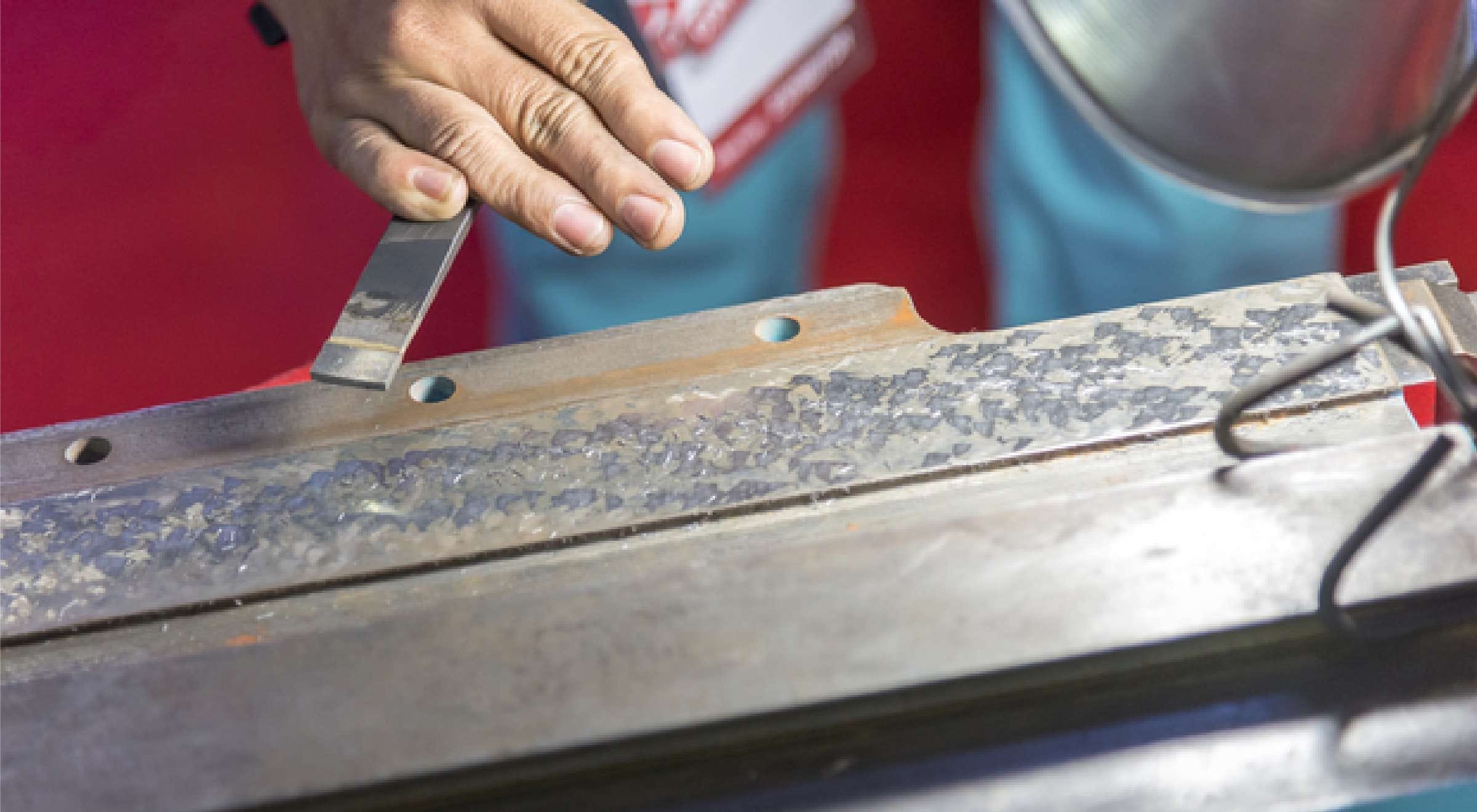 Hand scraping by an artisan